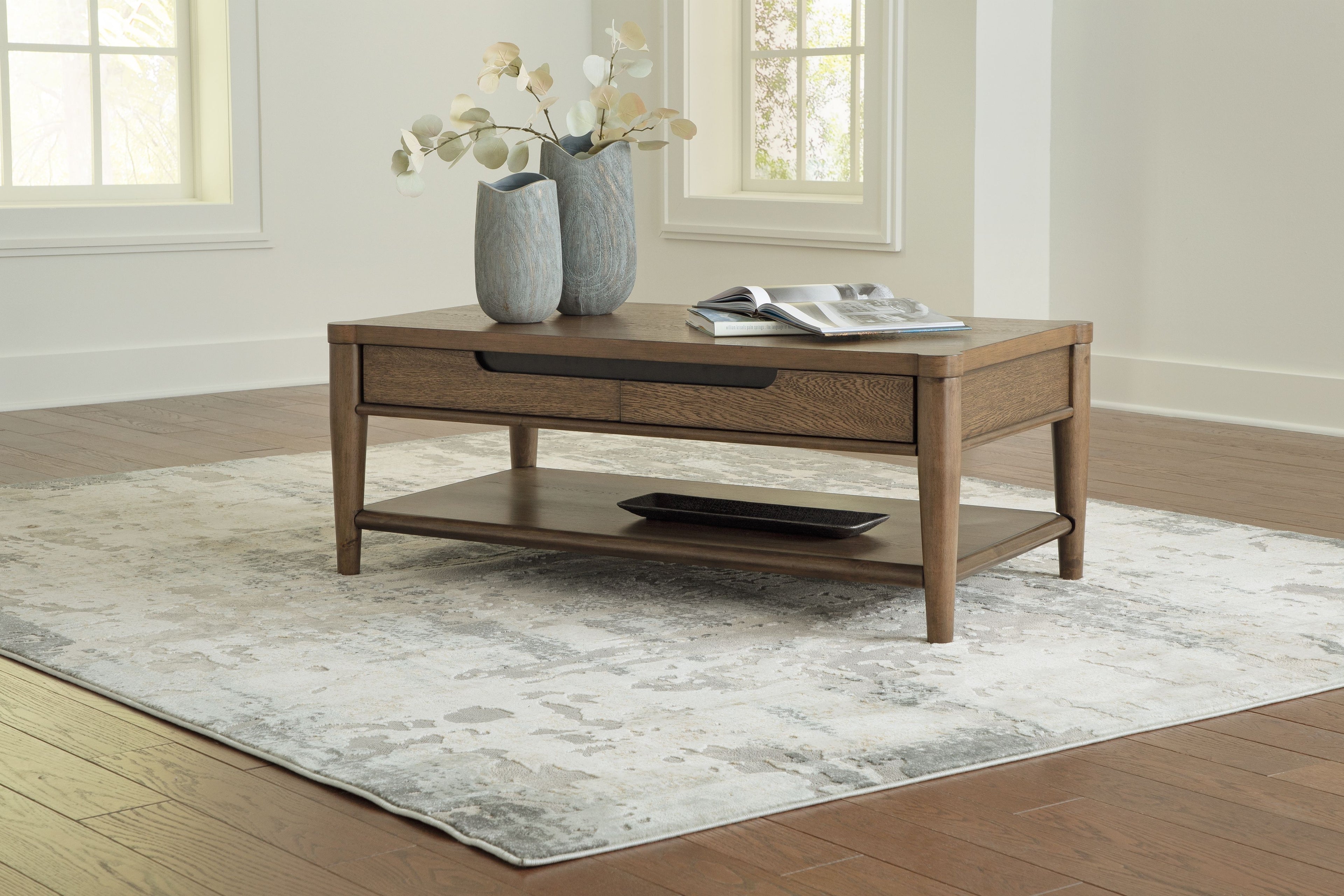 Rectangular brown coffee table with drawer and lower shelf; flowers and magazine on top