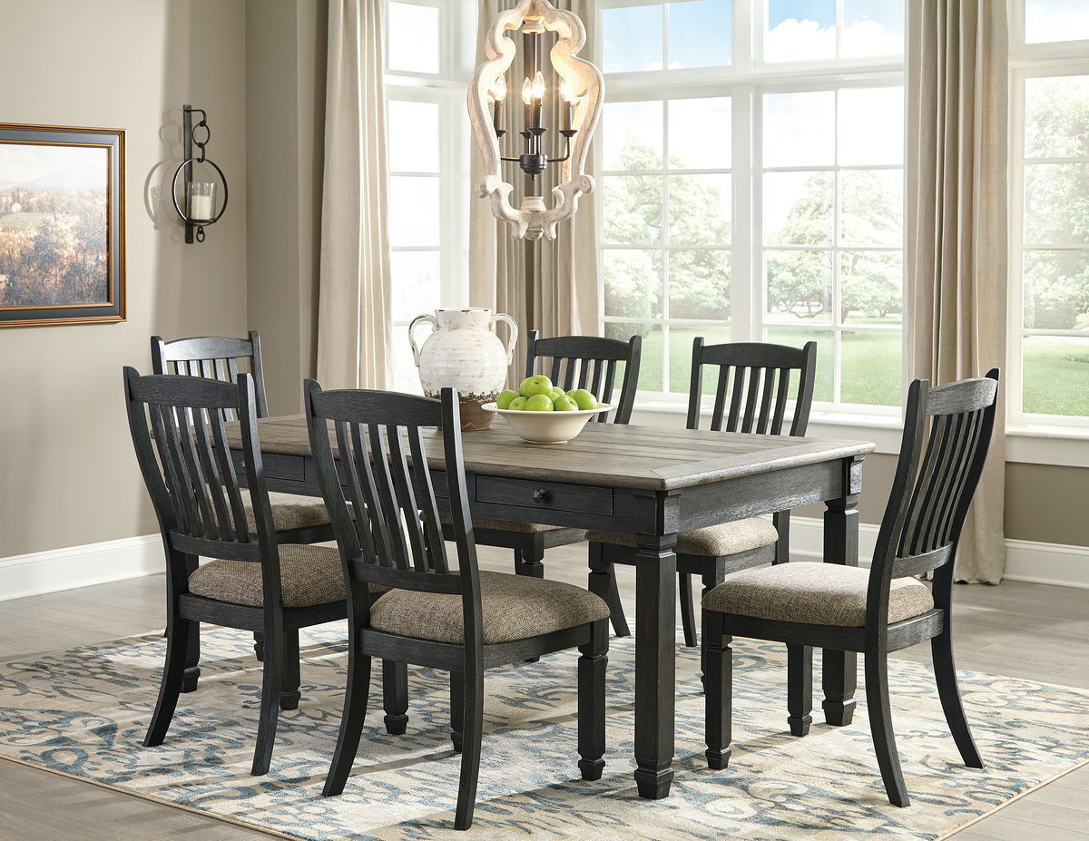 Dark gray dining table with four slat-back chairs and two upholstered seat benches