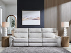 Three-seat reclining sofa in light gray fabric with cushioned back and arms