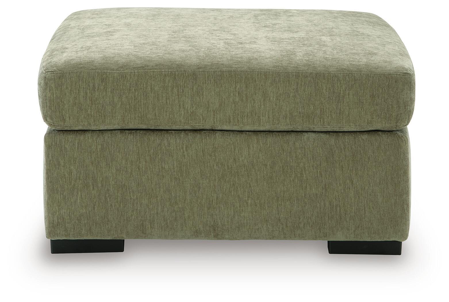 Oversized accent ottoman in textured green upholstery with padded seat cushion and dark legs.