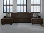 Chocolate sectional sofa with two chaise seats and patterned throw pillows