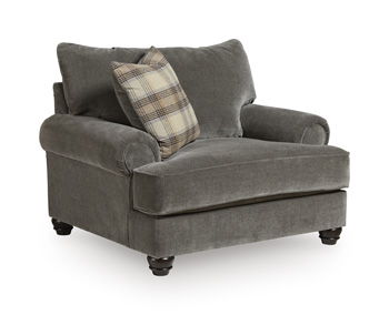 Dark gray upholstered chair and a half with rolled arms and plaid throw pillow