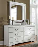 White dresser with mirror and multiple drawers, decorative bow-shaped handles