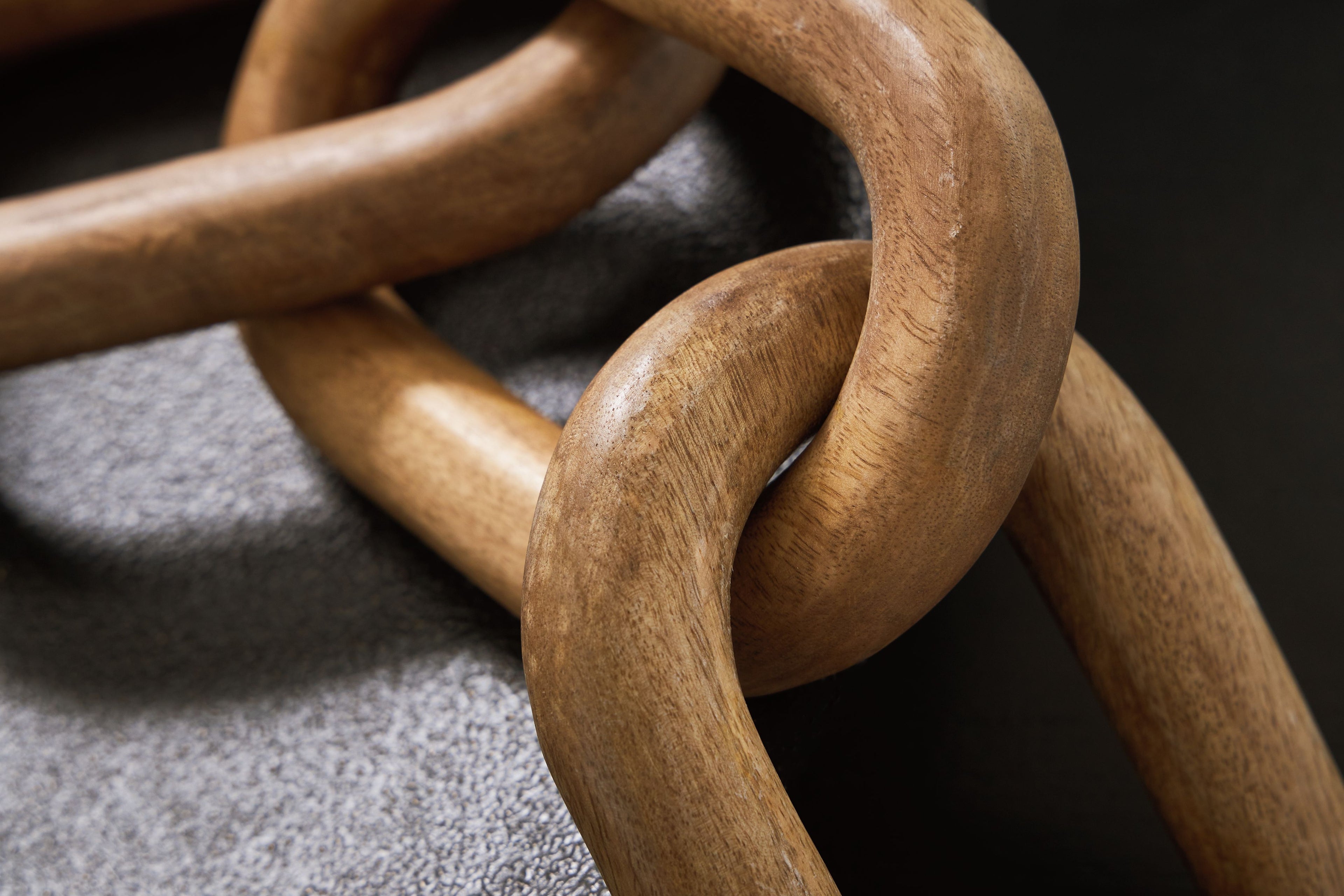 Light brown chain sculpture with large interlocking oval links