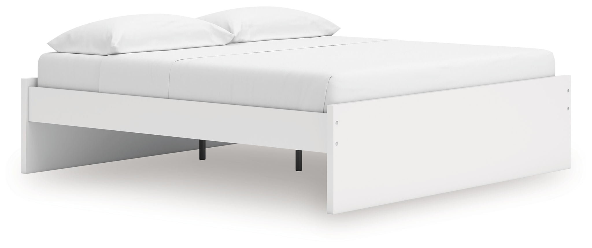 White platform bed with upholstered headboard and two pillows