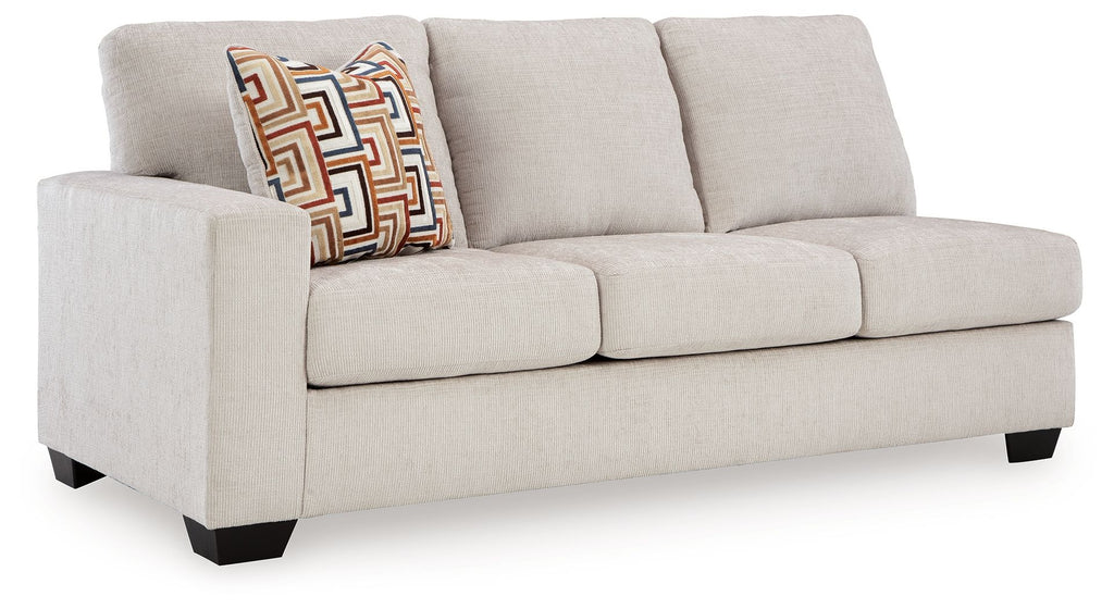 Stone fabric loveseat sofa with square arms, dark legs, and patterned throw pillow