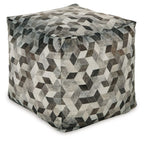 Geometric pouf ottoman with tasseled top, gray and black cube pattern