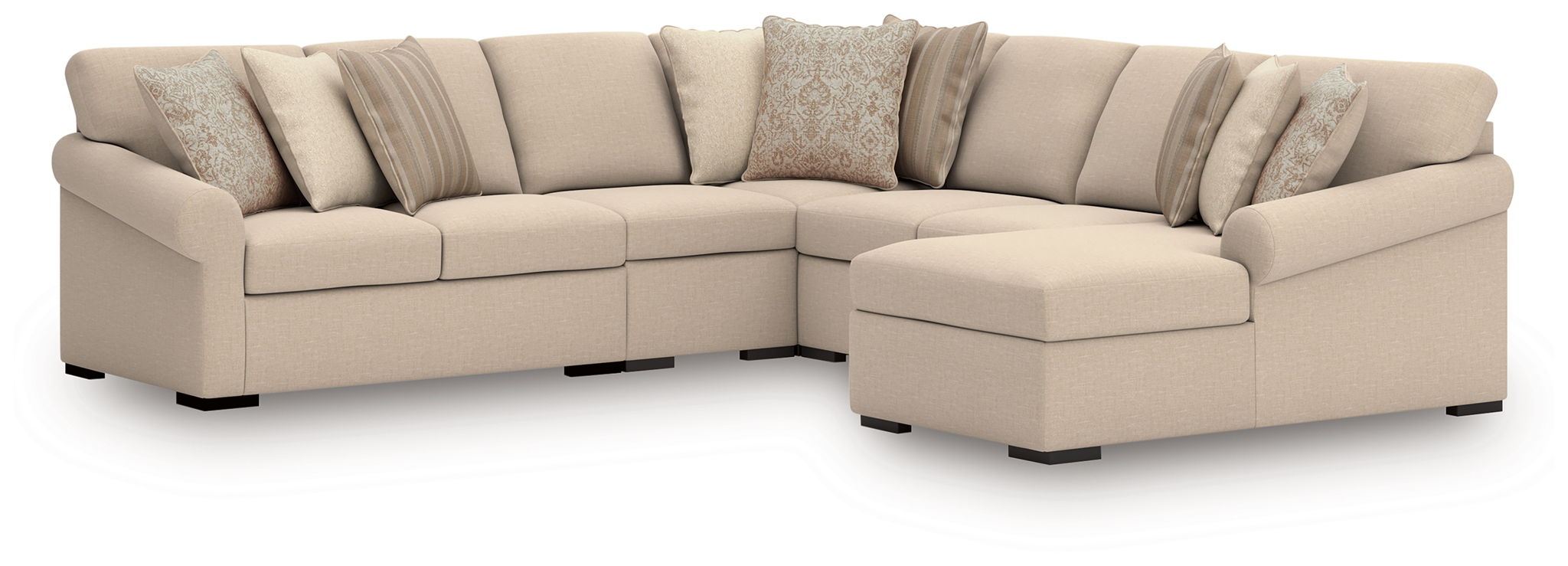 Light beige sectional sofa with corner chaise and a row of decorative pillows