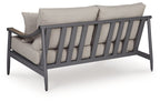 Gray outdoor loveseat with armrests and back slat panel, plus two throw pillows