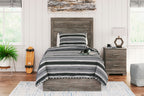 Dark gray wood-look panel bed with striped bedding and layered blankets