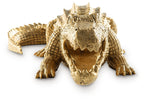 Antique gold crocodile sculpture from above, detailed head and clawed feet