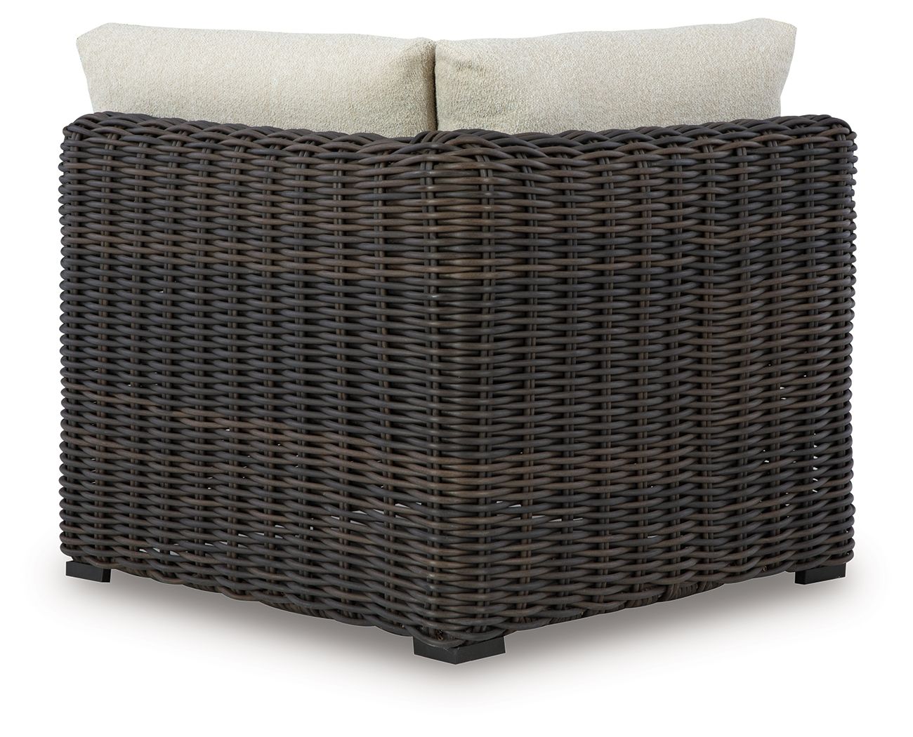Corner sofa chair with beige back cushions on dark brown wicker