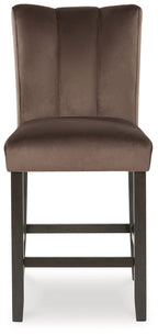 Mocha upholstered barstool with vertical back panel and dark wooden frame