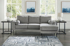 Charcoal chaise sofa with chaise arm and two round accent pillows