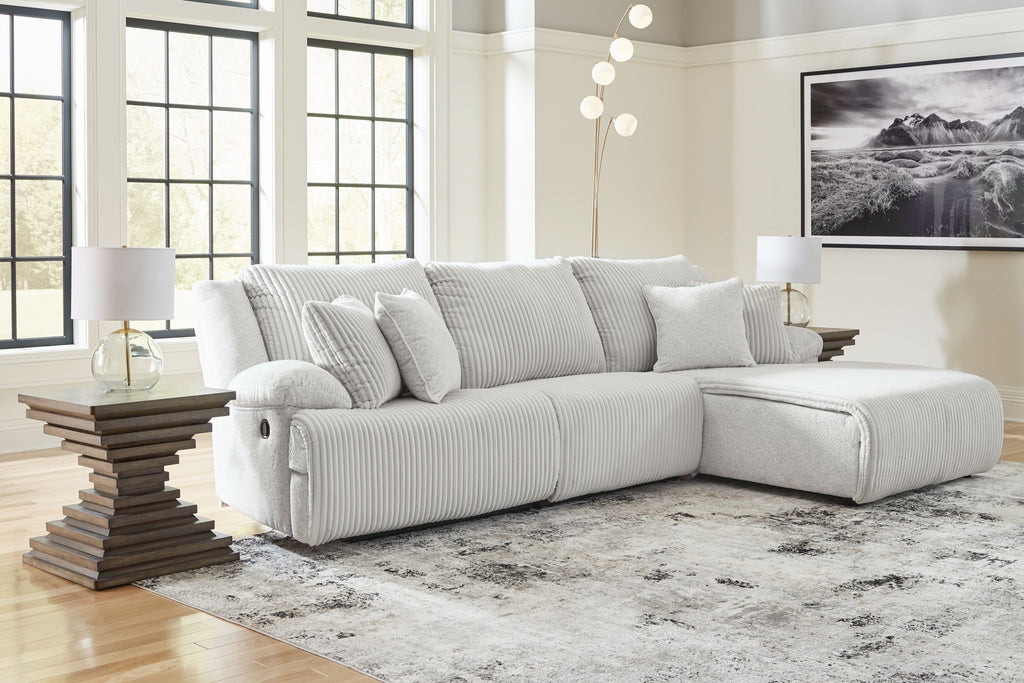 Light gray corduroy-style reclining sectional sofa with chaise and side arm rests