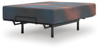 Gray hybrid mattress with quilted top, raised on black metal base legs