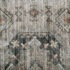 Close-up of decorative pillow fabric with dark gray geometric motif