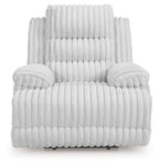 Light gray zero wall recliner with thick armrests, tufted backrest, and vertical channel quilting