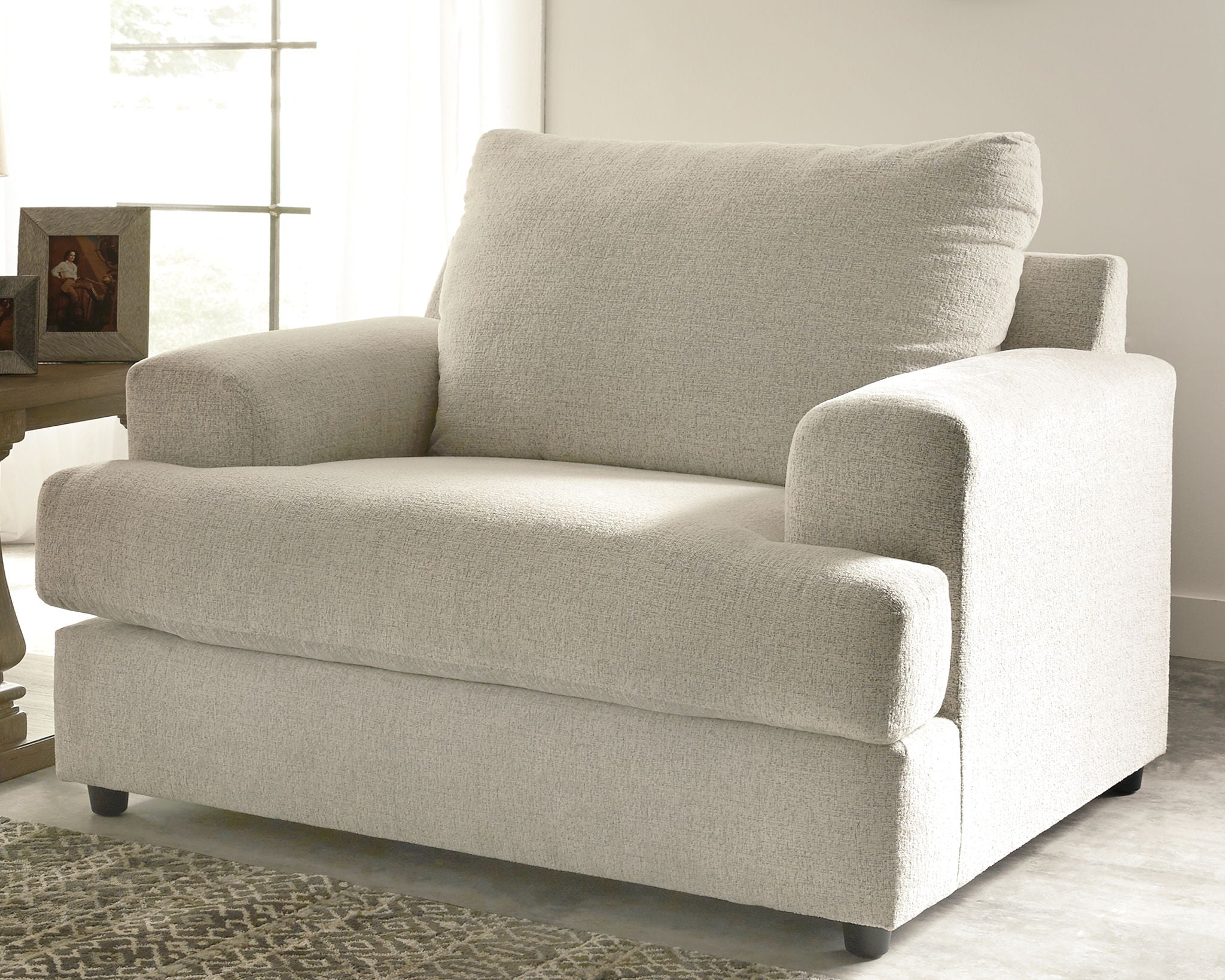 Stone-colored chair and a half with deep seat, wide arms, and tall back cushion