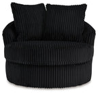 Swivel chair with ribbed black upholstery, two back pillows, and thick seat cushion