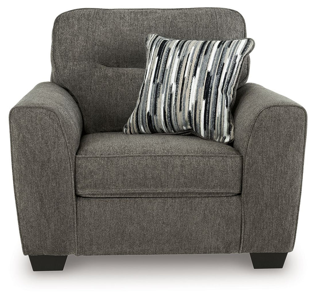 Dark gray accent chair with a striped throw pillow on the seat