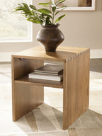 Light brown rectangular table with open shelf, styled with vase and stacked books