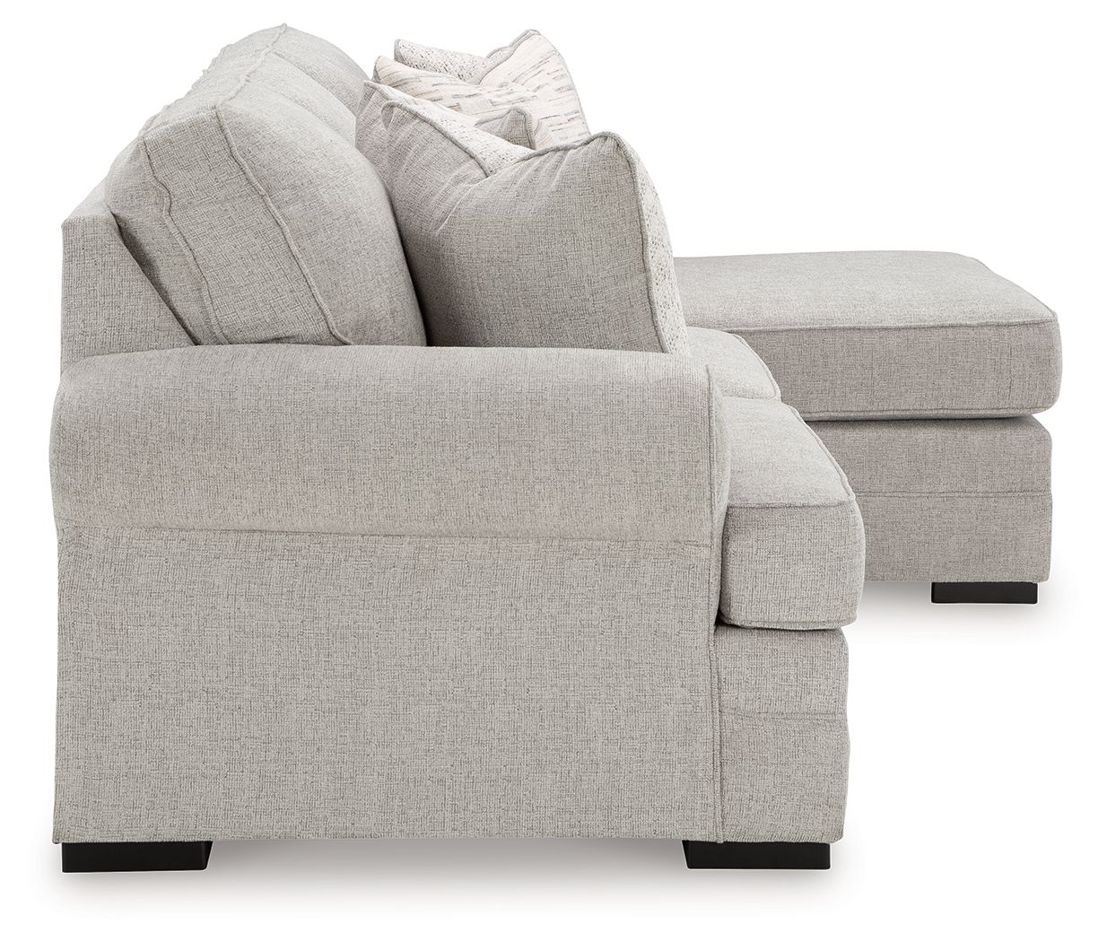 Gray upholstered armchair with rolled arms and decorative throw pillows