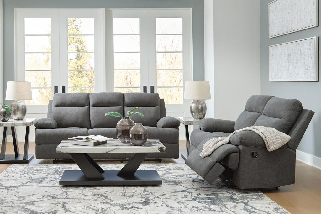 Dark gray reclining living room set with sofa, loveseat, and recliner with headrests