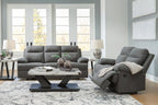 Dark gray reclining living room set with sofa, loveseat, and recliner with headrests
