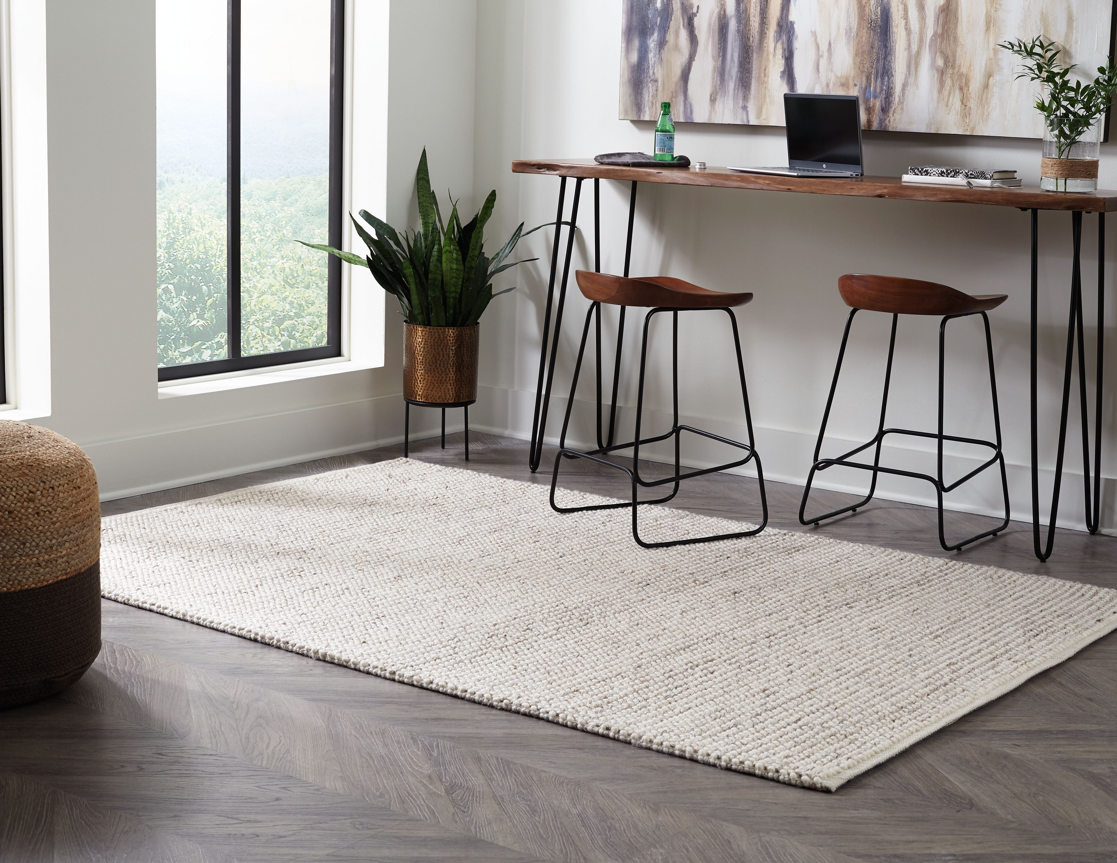 Beige Jossick woven rug with textured pattern, laid flat in living space