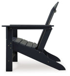 Outdoor Adirondack chair in black with extended leg rest and slanted seat frame.