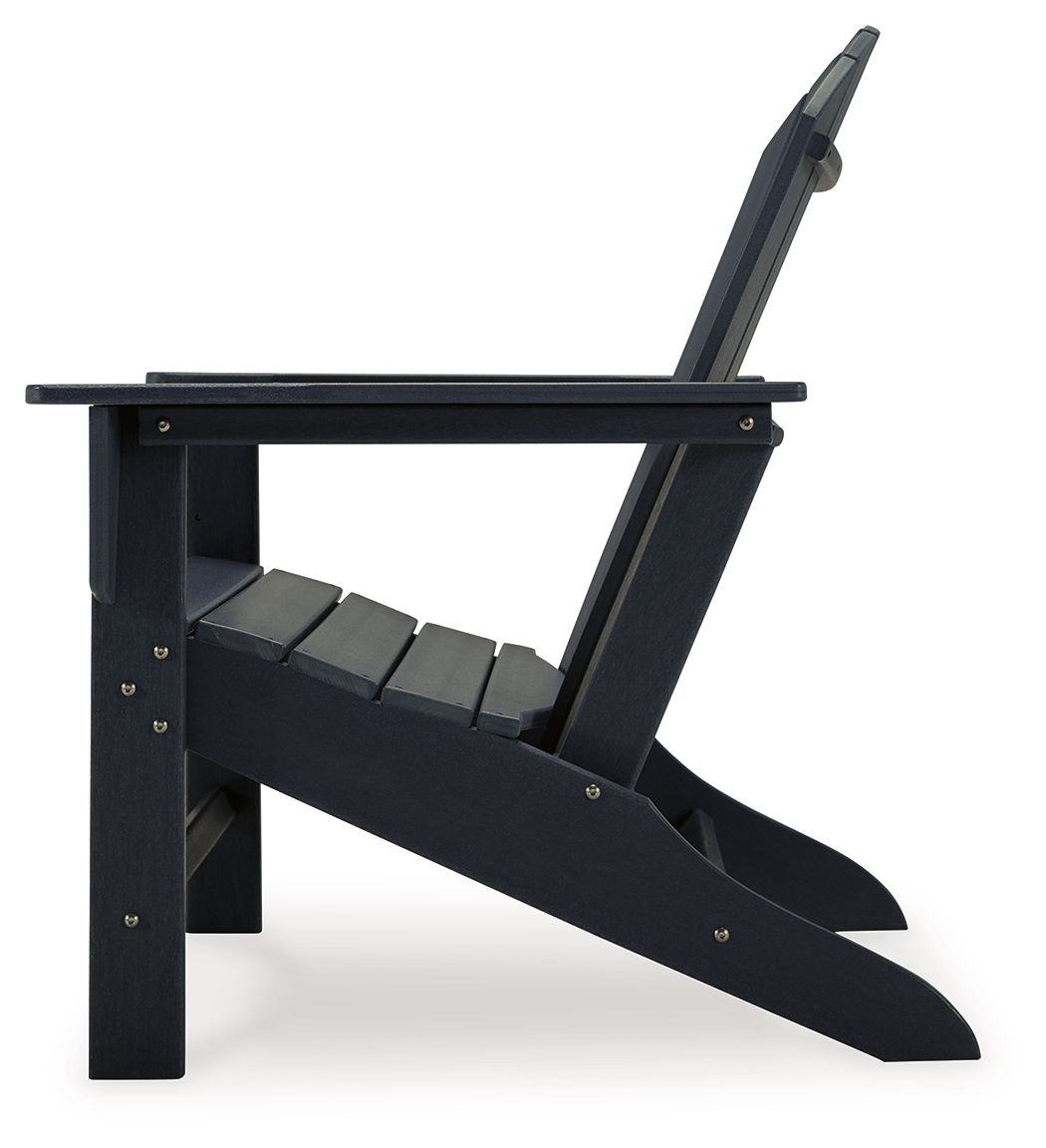 Outdoor Adirondack chair in black with extended leg rest and slanted seat frame.