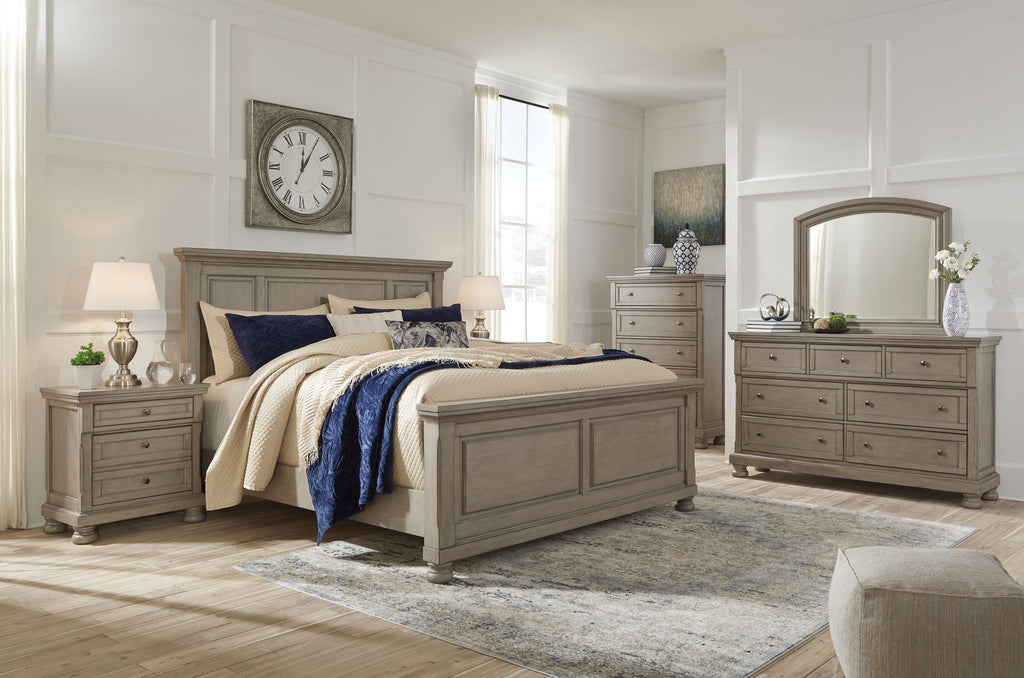 Lettner sleigh bed with drawers, gray frame and cream throw with blue blanket