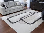 Beige rug with bold black geometric rectangles