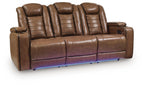 Brown leather power reclining sofa with adjustable headrests, padded arms and storage console