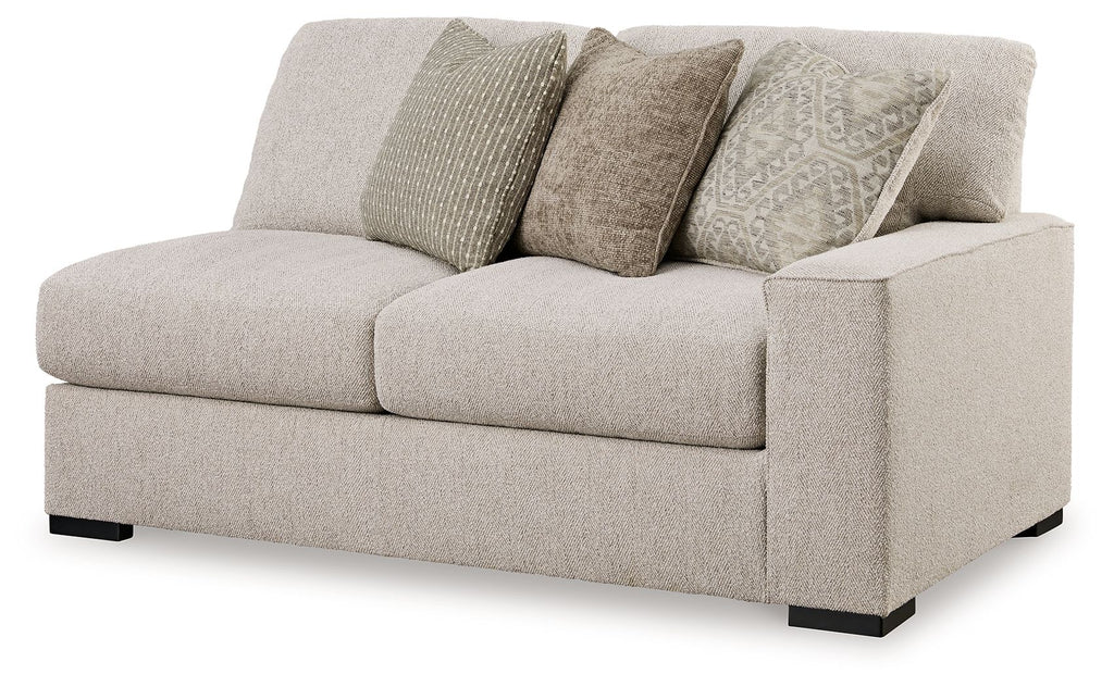 Sand-colored fabric loveseat with three seat cushions and dark feet