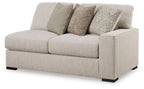 Sand-colored fabric loveseat with three seat cushions and dark feet