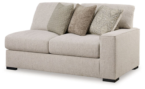Sand-colored fabric loveseat with three seat cushions and dark feet