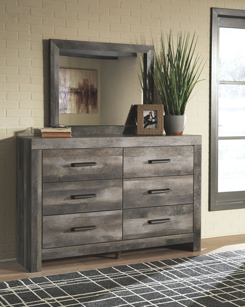 Gray dresser with framed mirror and six drawers with bar handles