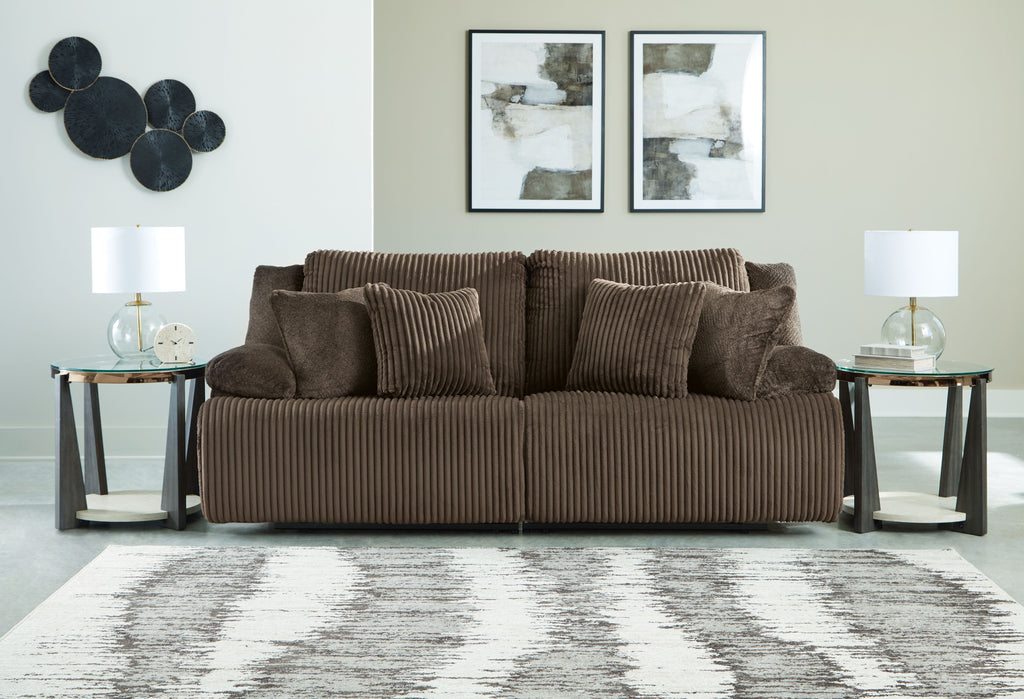 Dark brown corduroy-style reclining sectional sofa with pillow back and wide seat