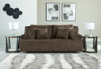 Dark brown corduroy-style reclining sectional sofa with pillow back and wide seat