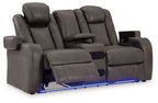 Dark gray power reclining loveseat with center console and reclined chaise-style seats