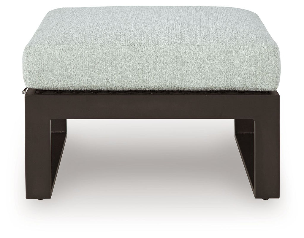 Ottoman with cushion, light gray seat on dark open-frame legs