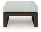 Ottoman with cushion, light gray seat on dark open-frame legs