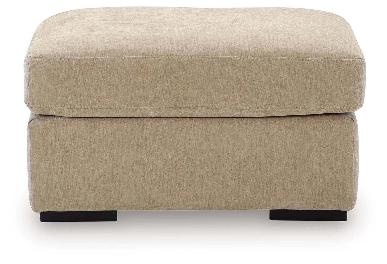 Beige fabric ottoman with cushioned top and black block legs, front view
