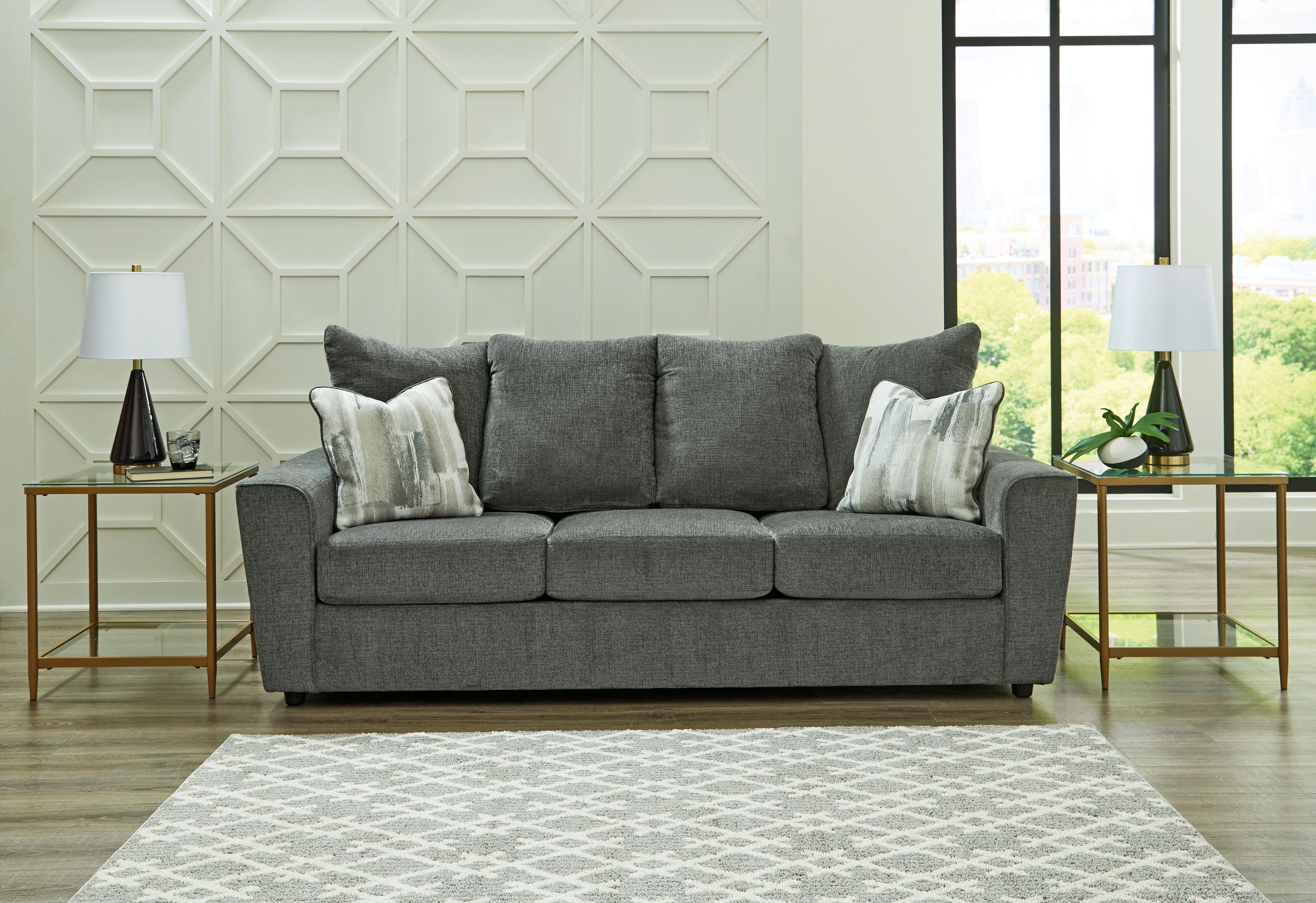 Stairatt sofa in gravel gray with three seat cushions, back pillows, and light throw pillows