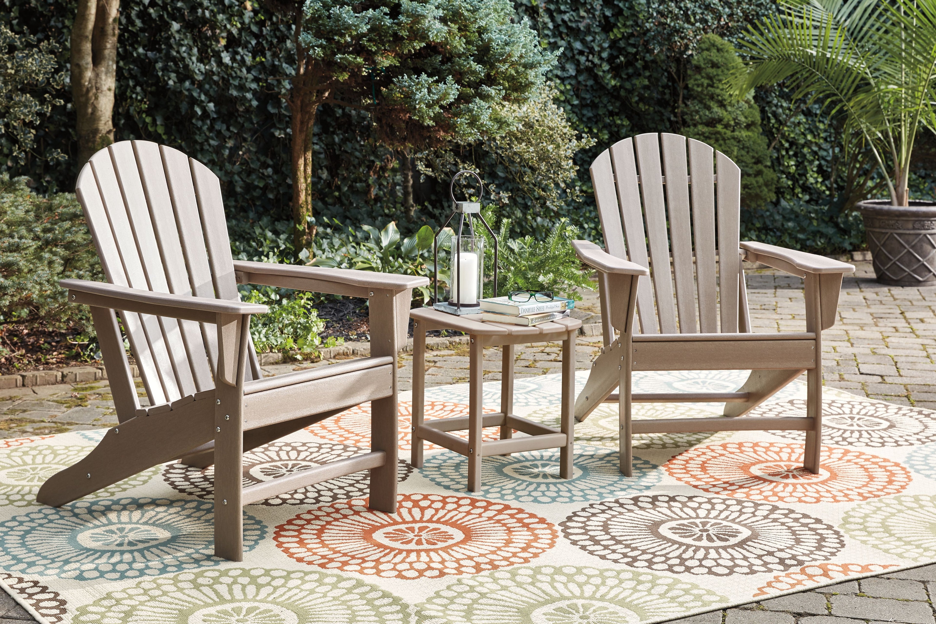 White outdoor conversation set: two Adirondack armchairs with matching side table