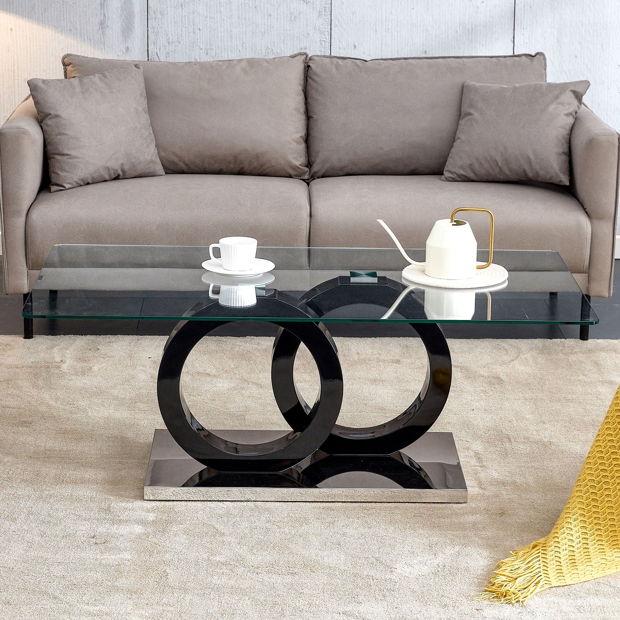 A Rectangular Modern And Fashionable Coffee Table With Tempered Glass Tabletop And Black Legs Suitable For Living Room