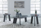 Set of 3 round gray occasional tables with dark tapered legs, staggered arrangement