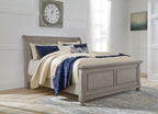 Lettner sleigh bed with two drawers, gray frame and blue-and-cream bedding